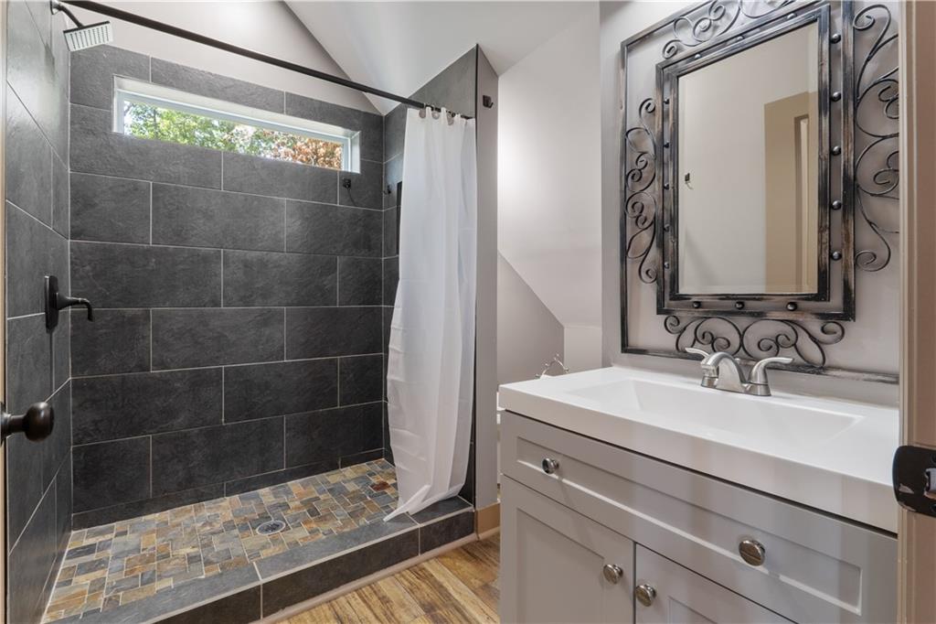 661 Wildcat Road Buchanan, GA 30113 - Photo 47 of 51 a bathroom with a sink and a mirror