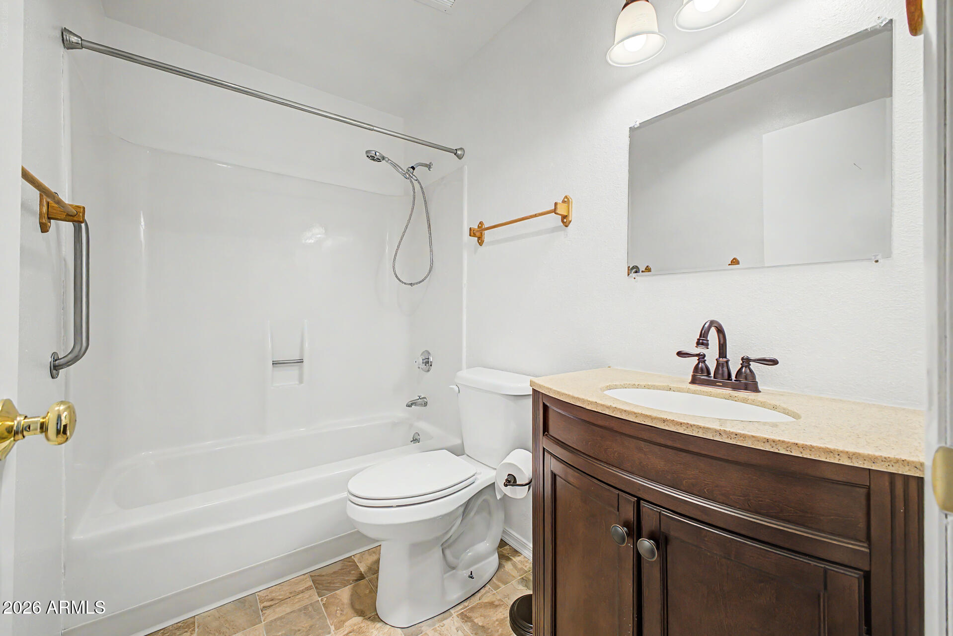 5873 East Thomas Road Scottsdale, AZ 85251 - Photo 14 of 30 a bathroom with a sink a toilet and a bathtub