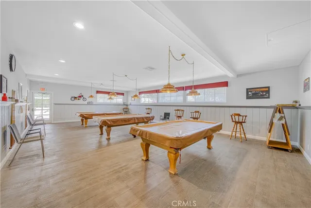 a room with furniture and pool table