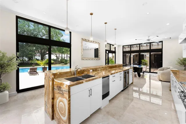 a large living room with a large window and furniture