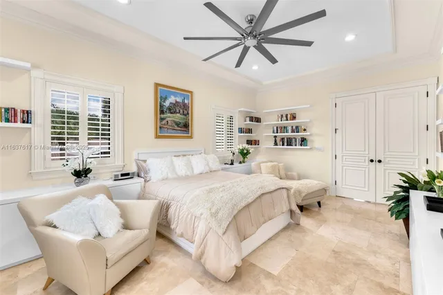 a living room filled with furniture and a book shelf