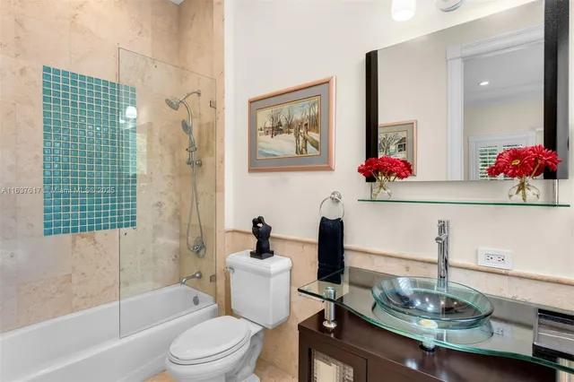 a bedroom with a large bed and a large window