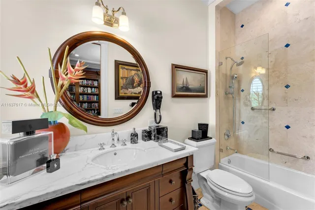 a living room with furniture and large windows