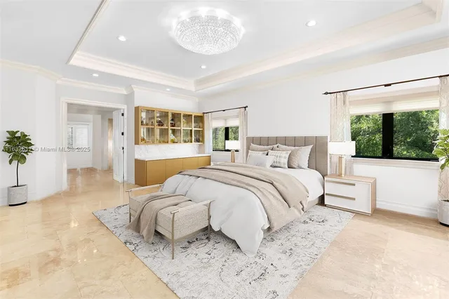 a bathroom with double vanity sinks mirror and a bathtub