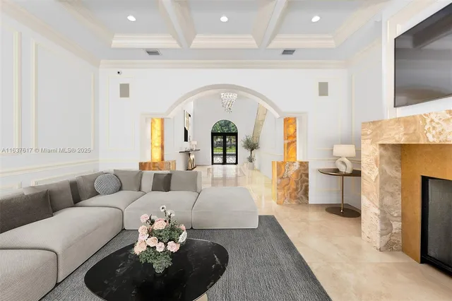 a living room with furniture fireplace and flat screen tv