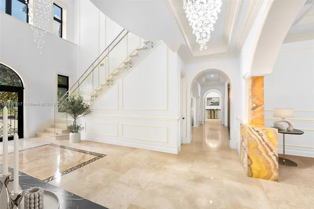 a view of a livingroom with furniture and staircase