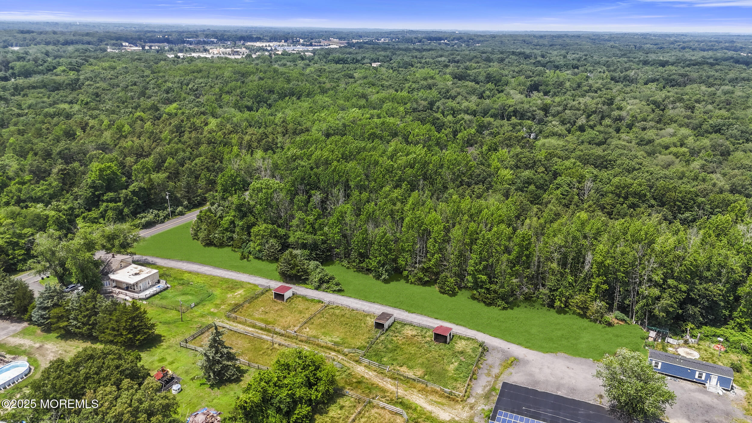 1070 Maxim Southard Road Howell, NJ 07731 - Photo 4 of 9 a view of a city with lush green forest