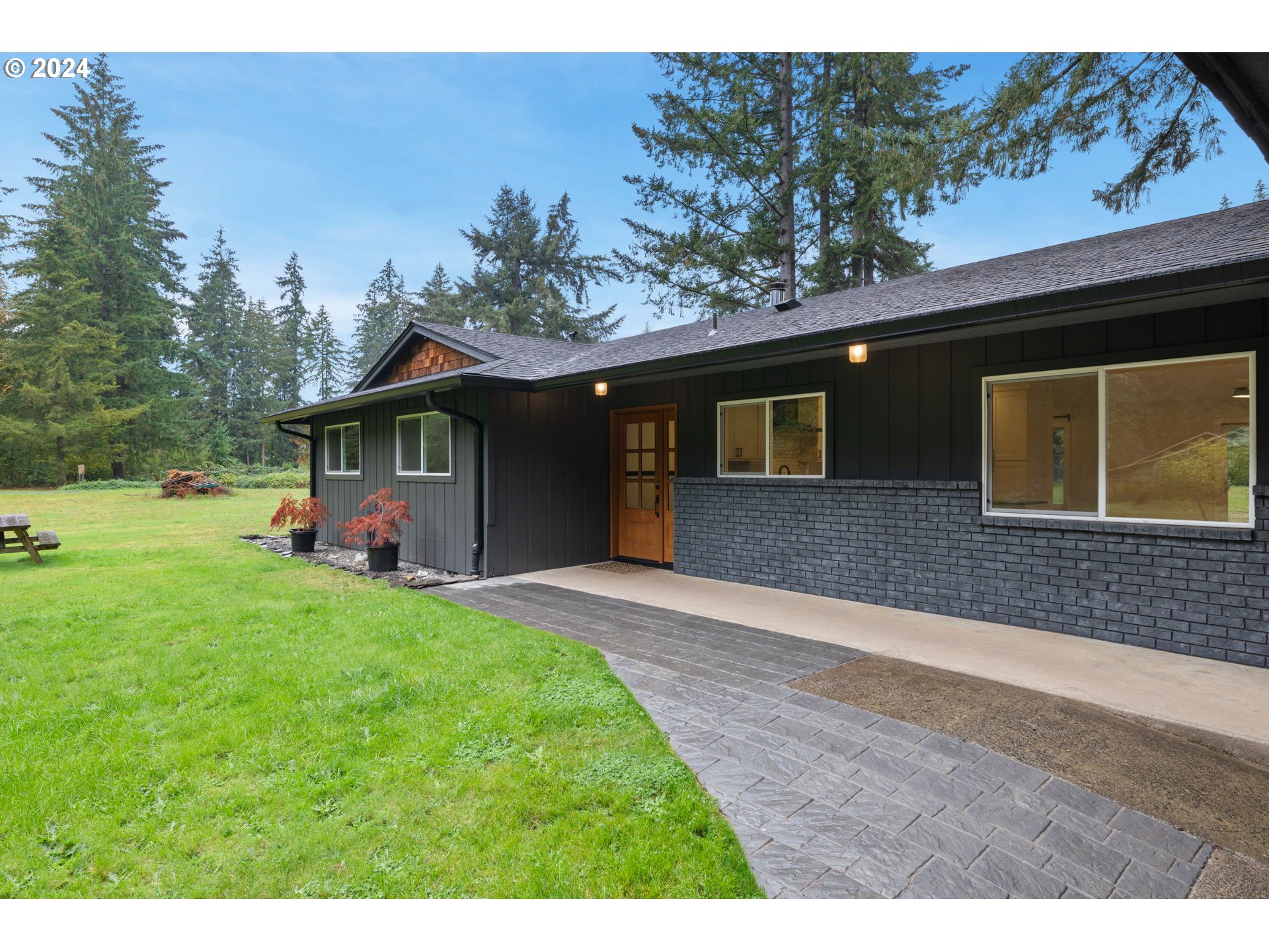 12604 Northeast Potter Road Battle Ground, WA 98604 - Photo 4 of 48 a front view of a house with garden