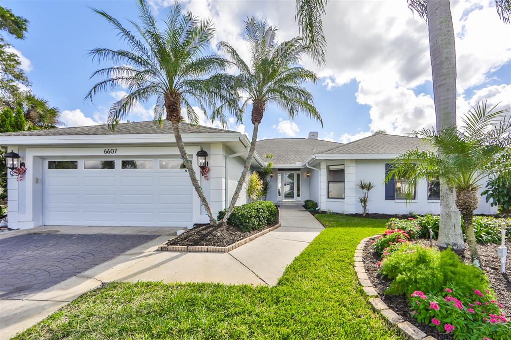 6607 Black Fin Way Apollo Beach, FL 33572 - Photo 1 of 1 a front view of a house with garden