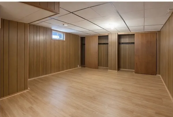 a view of a room with wooden floor