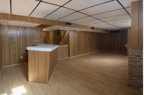 a view of an empty room with a fireplace