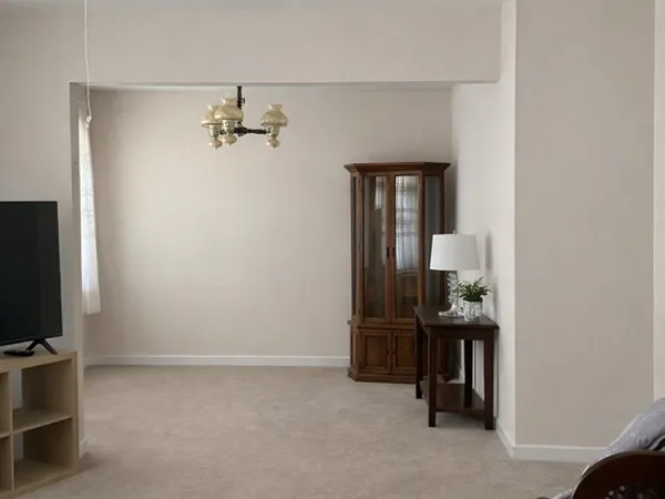 an empty room with a mirror