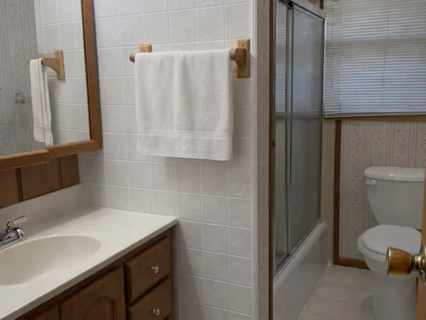a bathroom with a sink and toilet