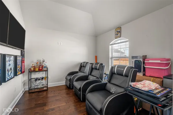 a bedroom with furniture and a window