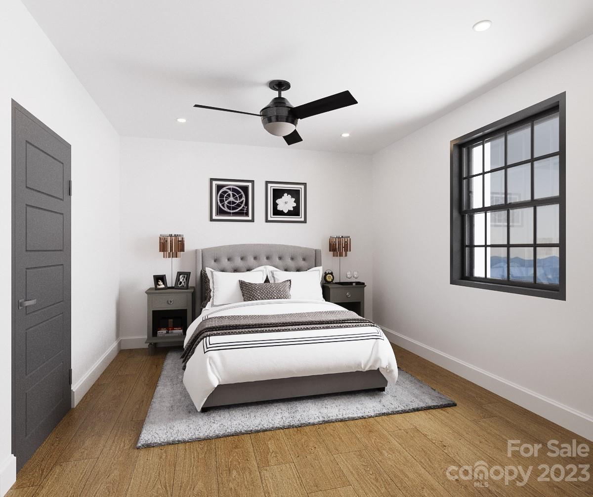 203 Grandin Road, Unit 3 Charlotte, NC 28208 - Photo 3 of 6 a bedroom with a large bed and a window