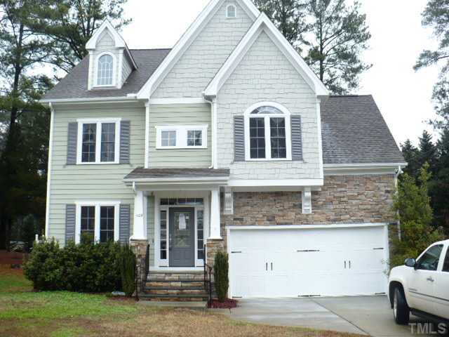 1109 Silas Ridge Court Raleigh, NC 27609 - Photo 1 of 23 a front view of a house with garden