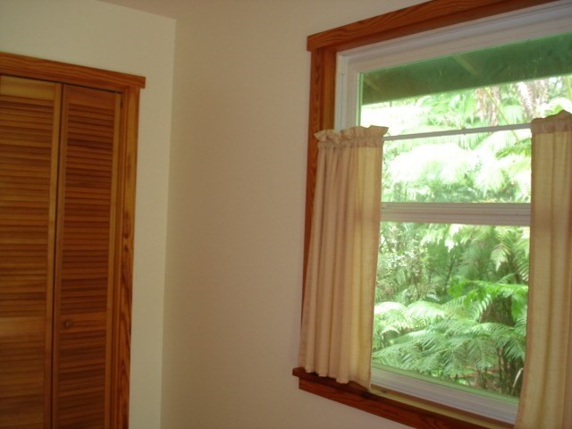 19-4031 Haunani Road Volcano, HI 96785 - Photo 11 of 21 a view of a room with a large window and front door