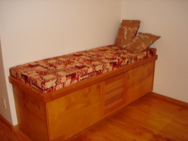 19-4031 Haunani Road Volcano, HI 96785 - Photo 7 of 21 a bed sitting in a bedroom next to a wall