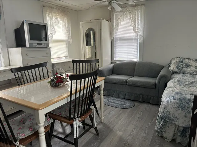 a view of a livingroom with furniture and a flat screen tv