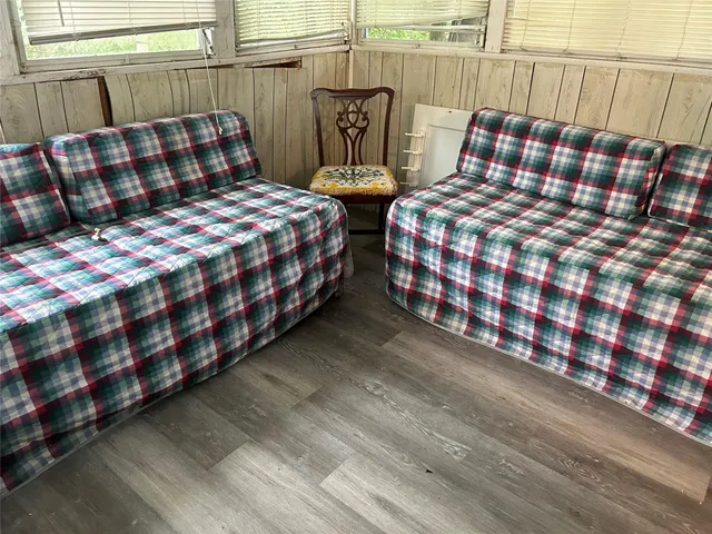 a bedroom with two beds and painted walls