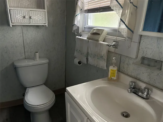 a bathroom with a sink and a toilet