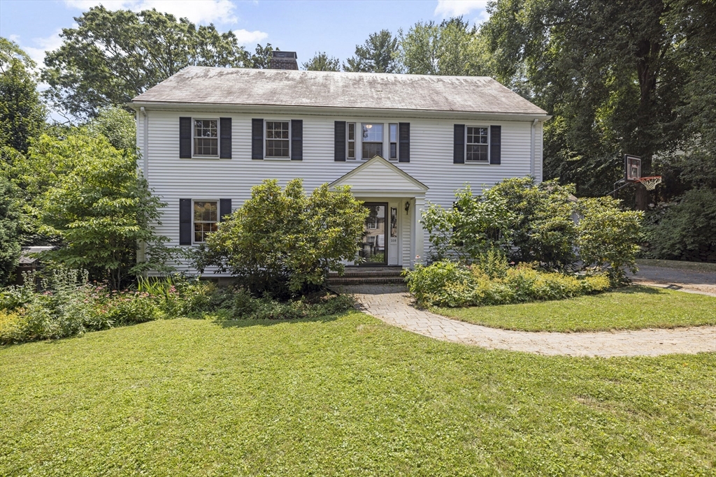 208 Rutledge Road Belmont, MA 02478 - Photo 1 of 34 a front view of a house with a yard