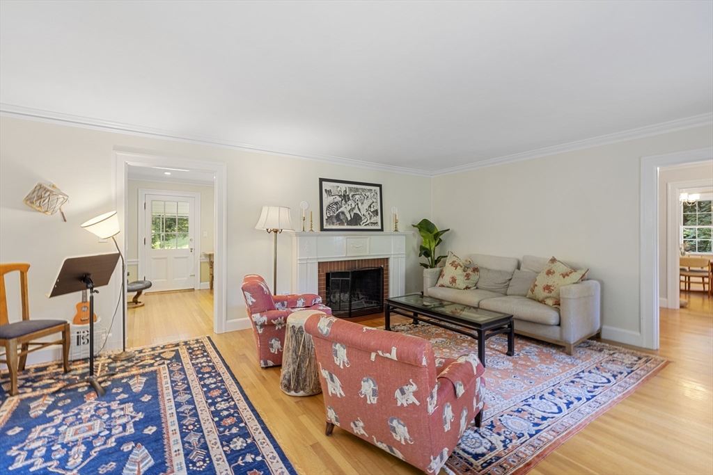 208 Rutledge Road Belmont, MA 02478 - Photo 11 of 34 a living room with furniture and a fireplace