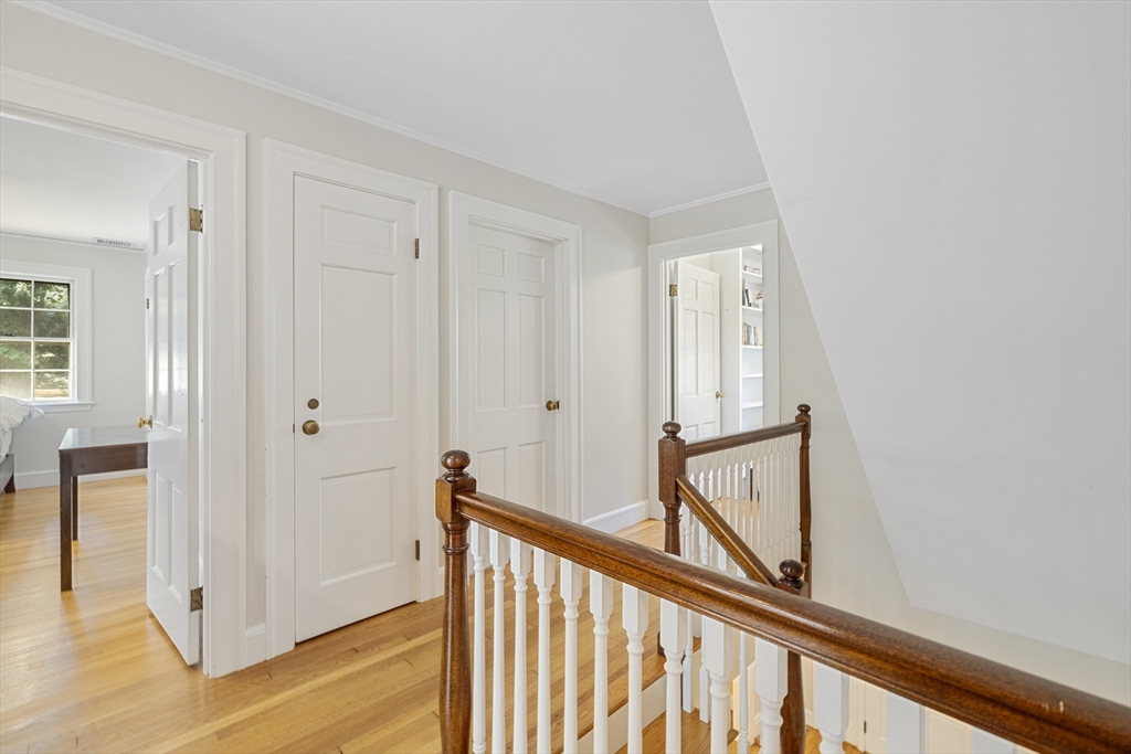 208 Rutledge Road Belmont, MA 02478 - Photo 18 of 34 a view of a hallway with wooden floor and entryway