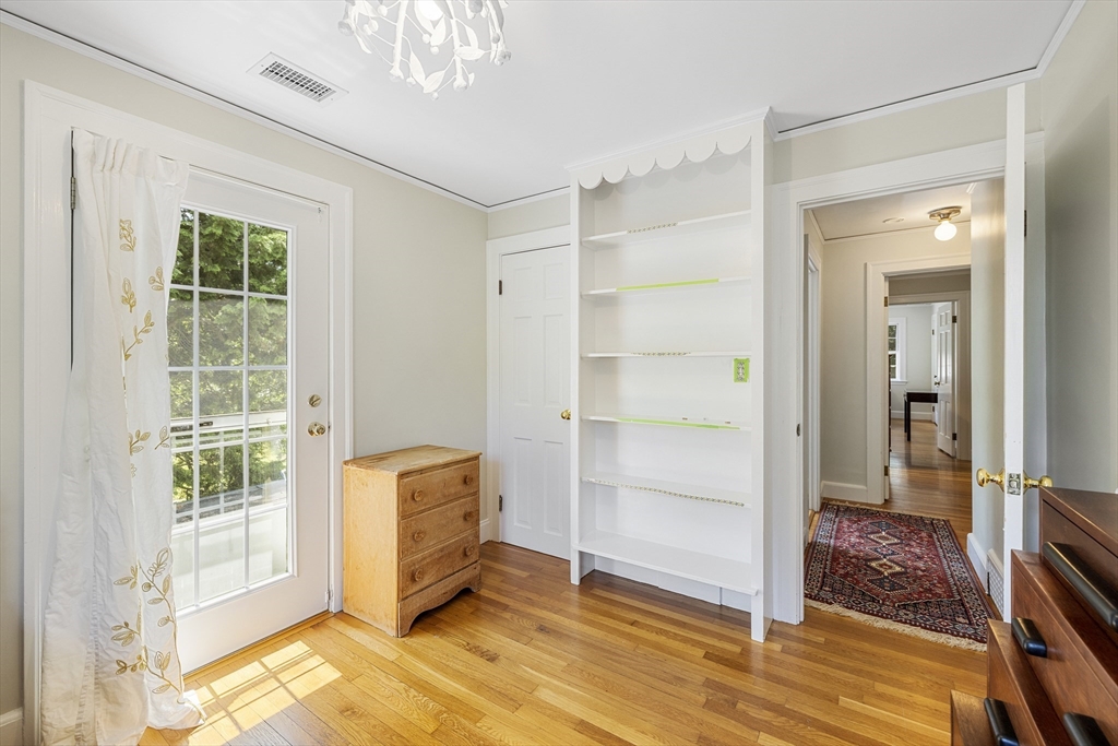 208 Rutledge Road Belmont, MA 02478 - Photo 23 of 34 a view of an empty room with wooden floor and a window