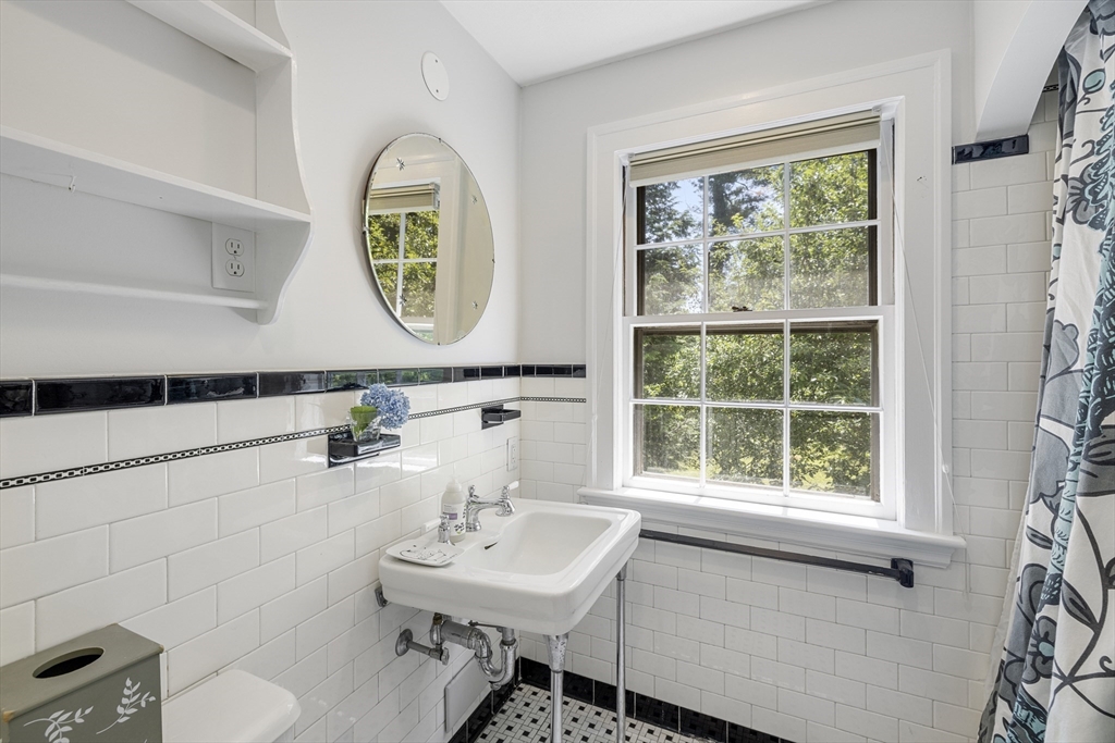 208 Rutledge Road Belmont, MA 02478 - Photo 27 of 34 a bathroom with a sink and a mirror