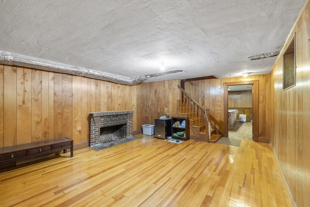 208 Rutledge Road Belmont, MA 02478 - Photo 28 of 34 a furnished livingroom with a fireplace