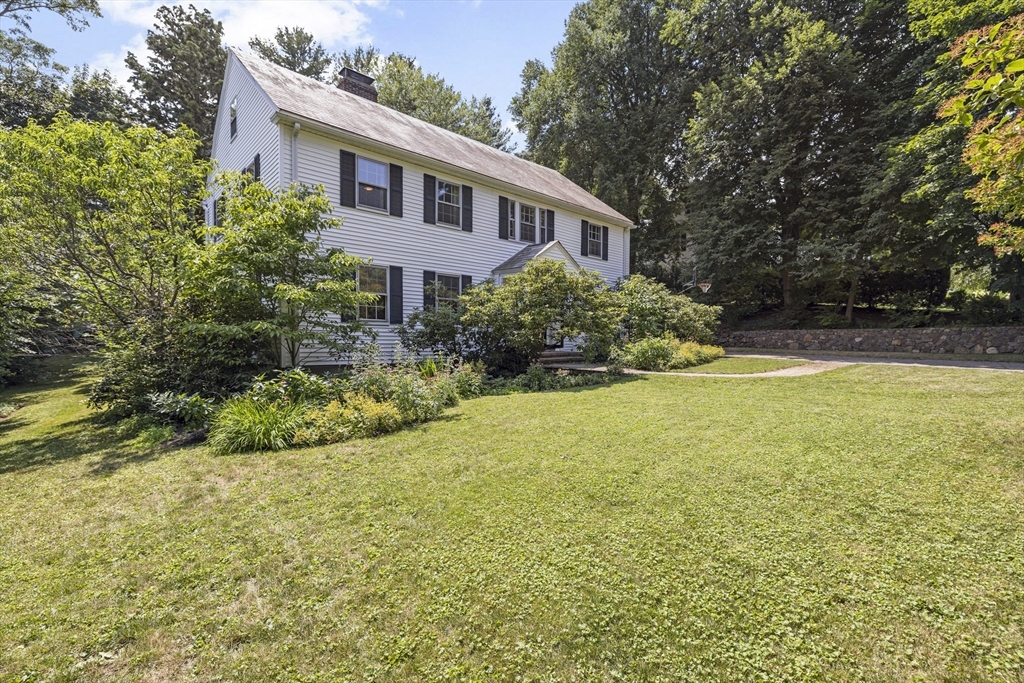 208 Rutledge Road Belmont, MA 02478 - Photo 29 of 34 a front view of a house with yard and green space