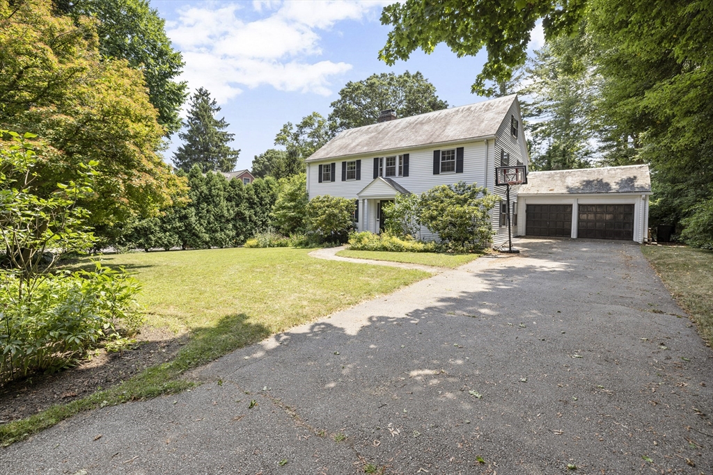 208 Rutledge Road Belmont, MA 02478 - Photo 30 of 34 a view of a house with backyard and trees