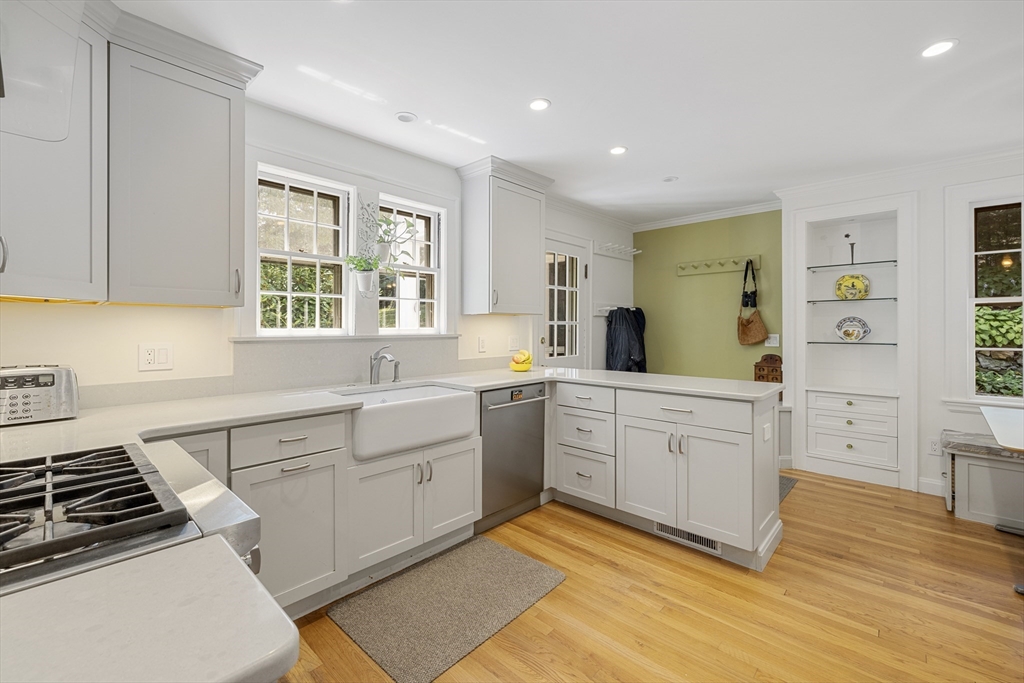 208 Rutledge Road Belmont, MA 02478 - Photo 5 of 34 a kitchen with a sink stove and cabinets