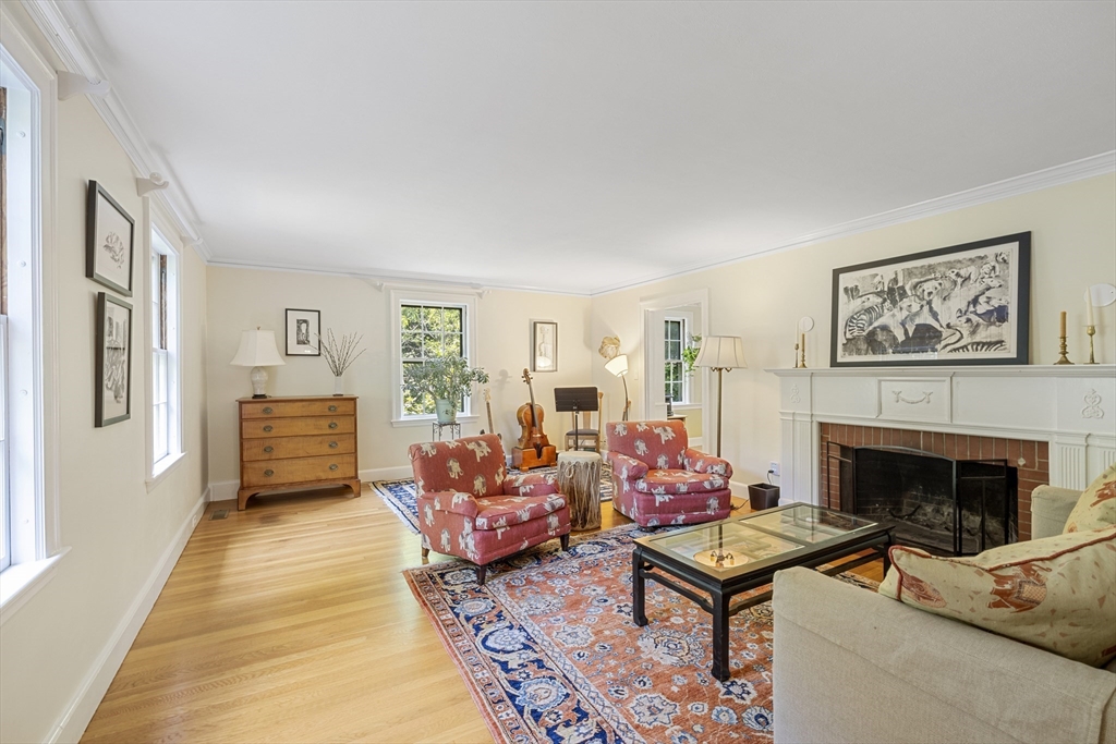 208 Rutledge Road Belmont, MA 02478 - Photo 10 of 34 a living room with furniture windows and a fireplace