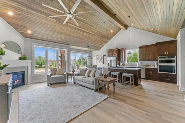 a living room with furniture wooden floor and a fireplace