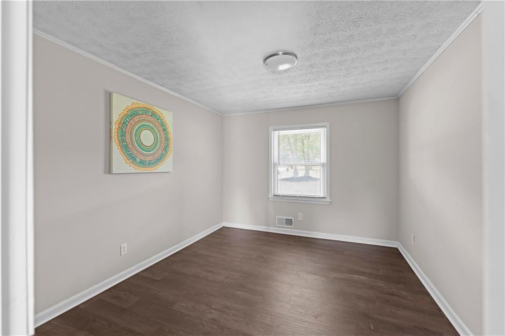 5245 Stonewall Tell Road Atlanta, GA 30349 - Photo 12 of 15 an empty room with a window