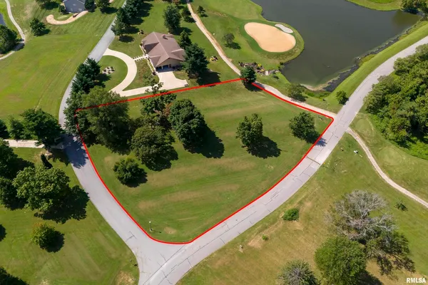an aerial view of a residential houses with outdoor space and swimming pool