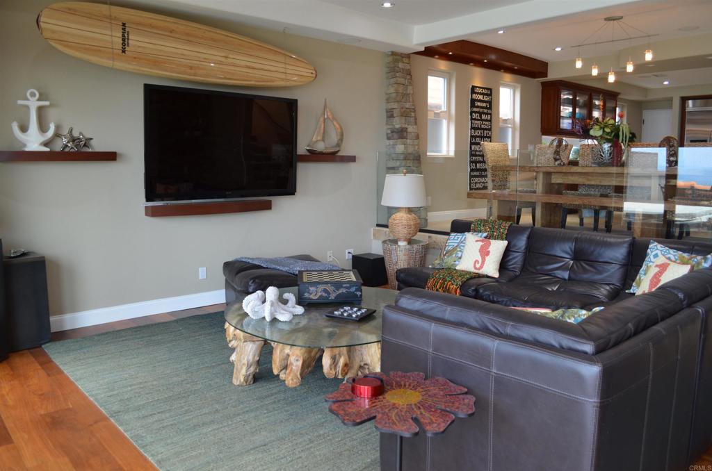 378 Neptune Avenue Encinitas, CA 92024 - Photo 14 of 45 a living room with furniture and a flat screen tv
