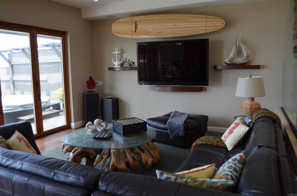378 Neptune Avenue Encinitas, CA 92024 - Photo 16 of 45 a living room with furniture and a fireplace