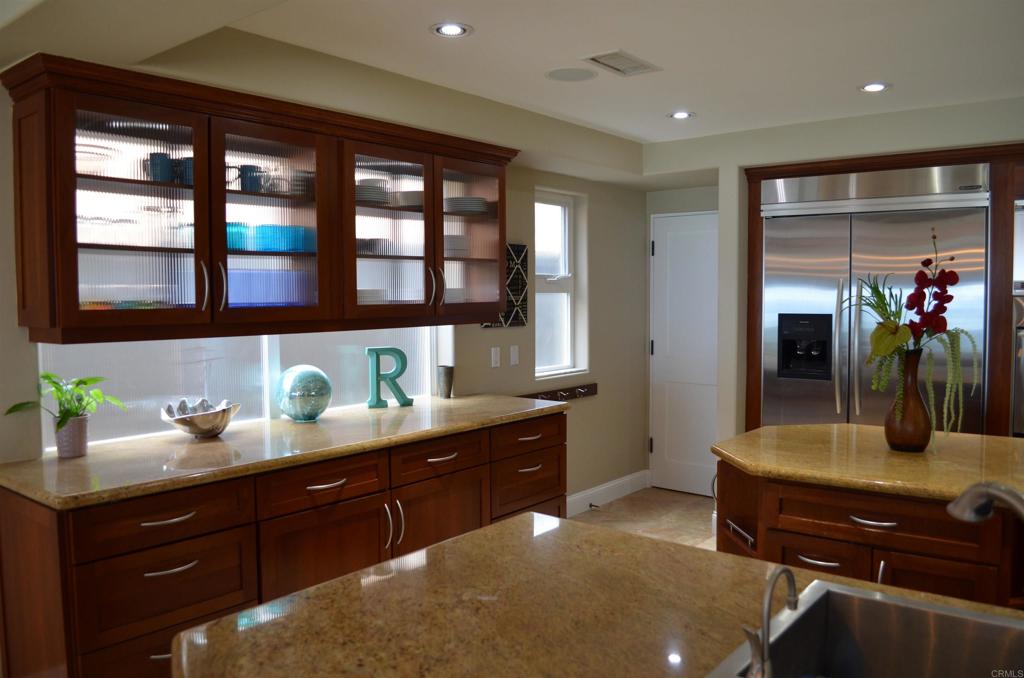 378 Neptune Avenue Encinitas, CA 92024 - Photo 18 of 45 a kitchen with a sink and cabinets