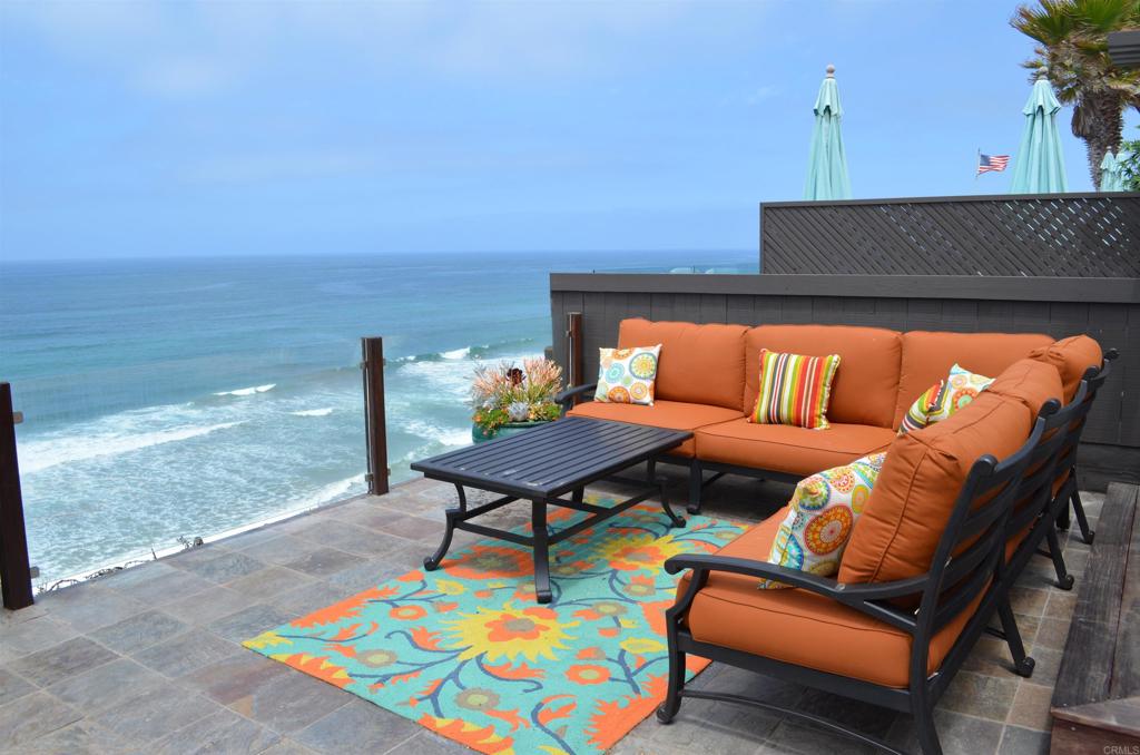 378 Neptune Avenue Encinitas, CA 92024 - Photo 2 of 45 a outdoor living space with furniture and a floor to ceiling window