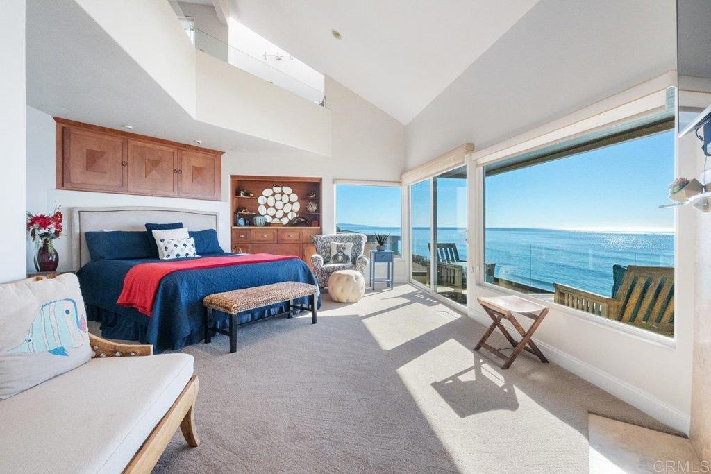 378 Neptune Avenue Encinitas, CA 92024 - Photo 30 of 45 a bedroom with a bed and glass walk in closet