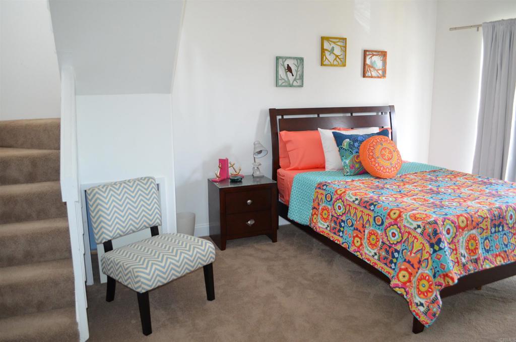 378 Neptune Avenue Encinitas, CA 92024 - Photo 39 of 45 a bedroom with a bed and chair