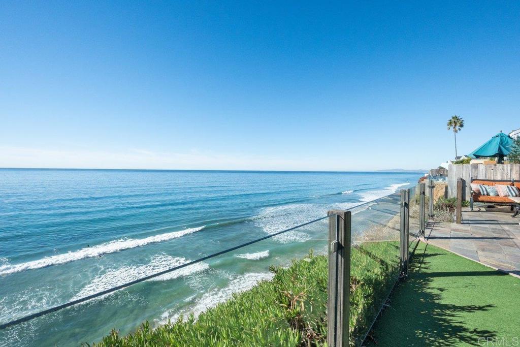 378 Neptune Avenue Encinitas, CA 92024 - Photo 7 of 45 a view of an ocean and a beach