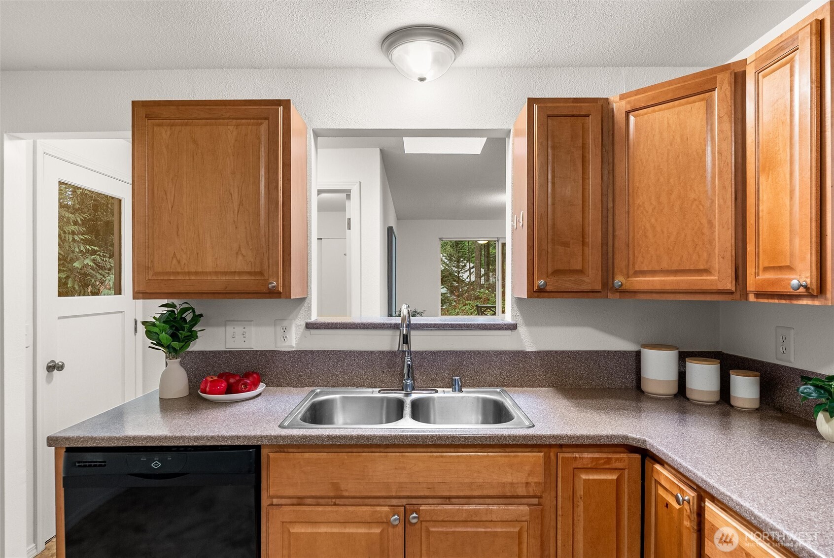 4785 Northwest Anderson Hill Road Silverdale, WA 98383 - Photo 11 of 38 a kitchen with a sink cabinets and window