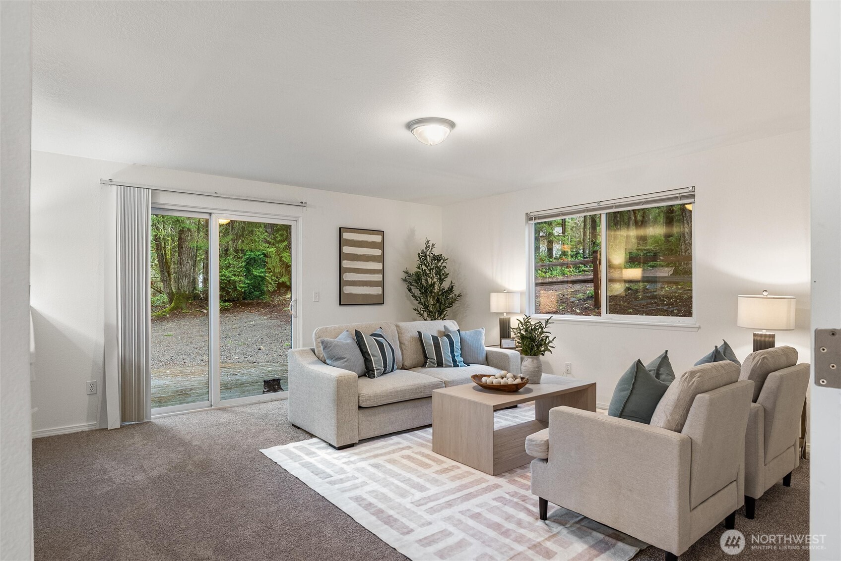 4785 Northwest Anderson Hill Road Silverdale, WA 98383 - Photo 17 of 38 a living room with furniture and a large window