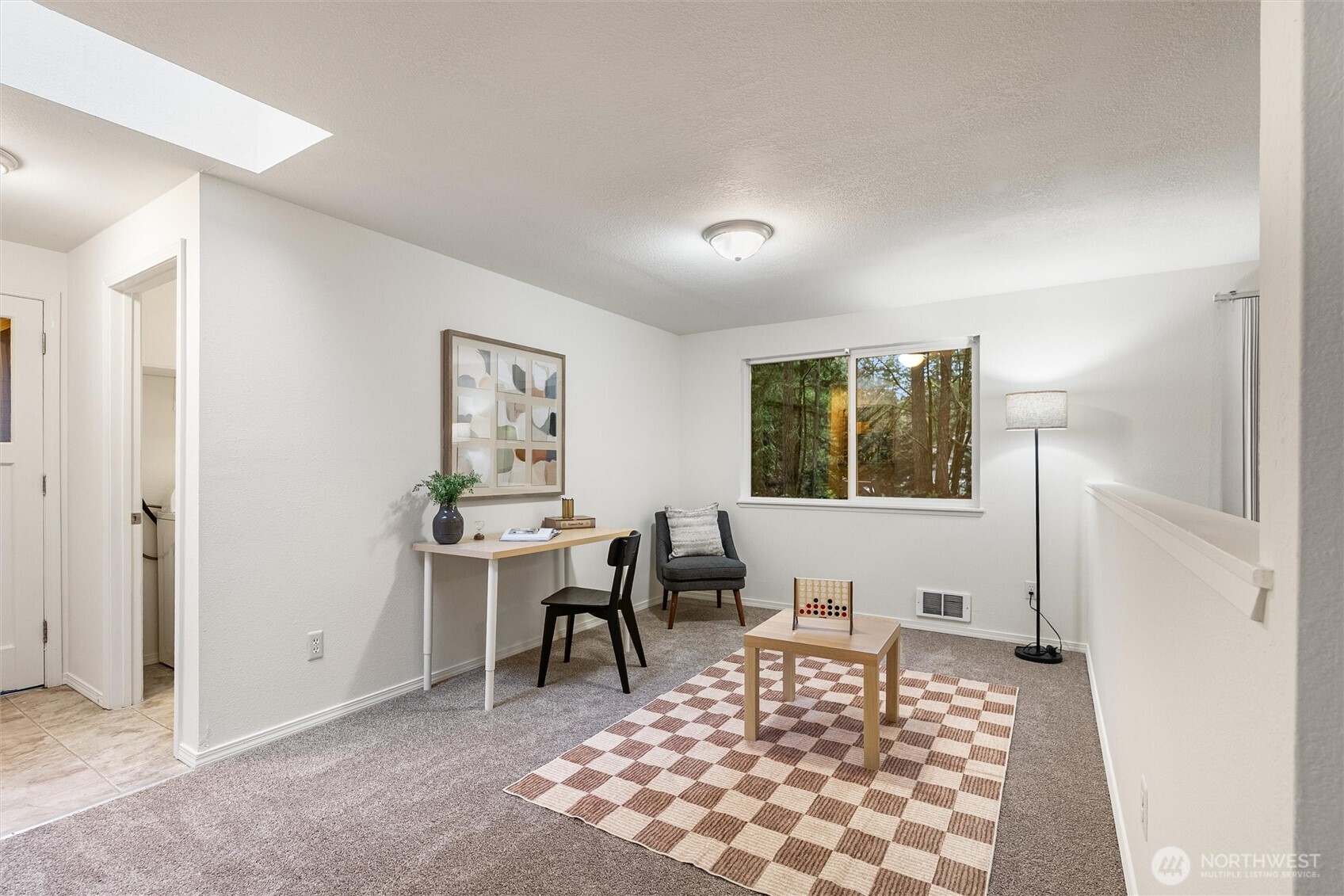 4785 Northwest Anderson Hill Road Silverdale, WA 98383 - Photo 20 of 38 a living room with furniture a rug and a window