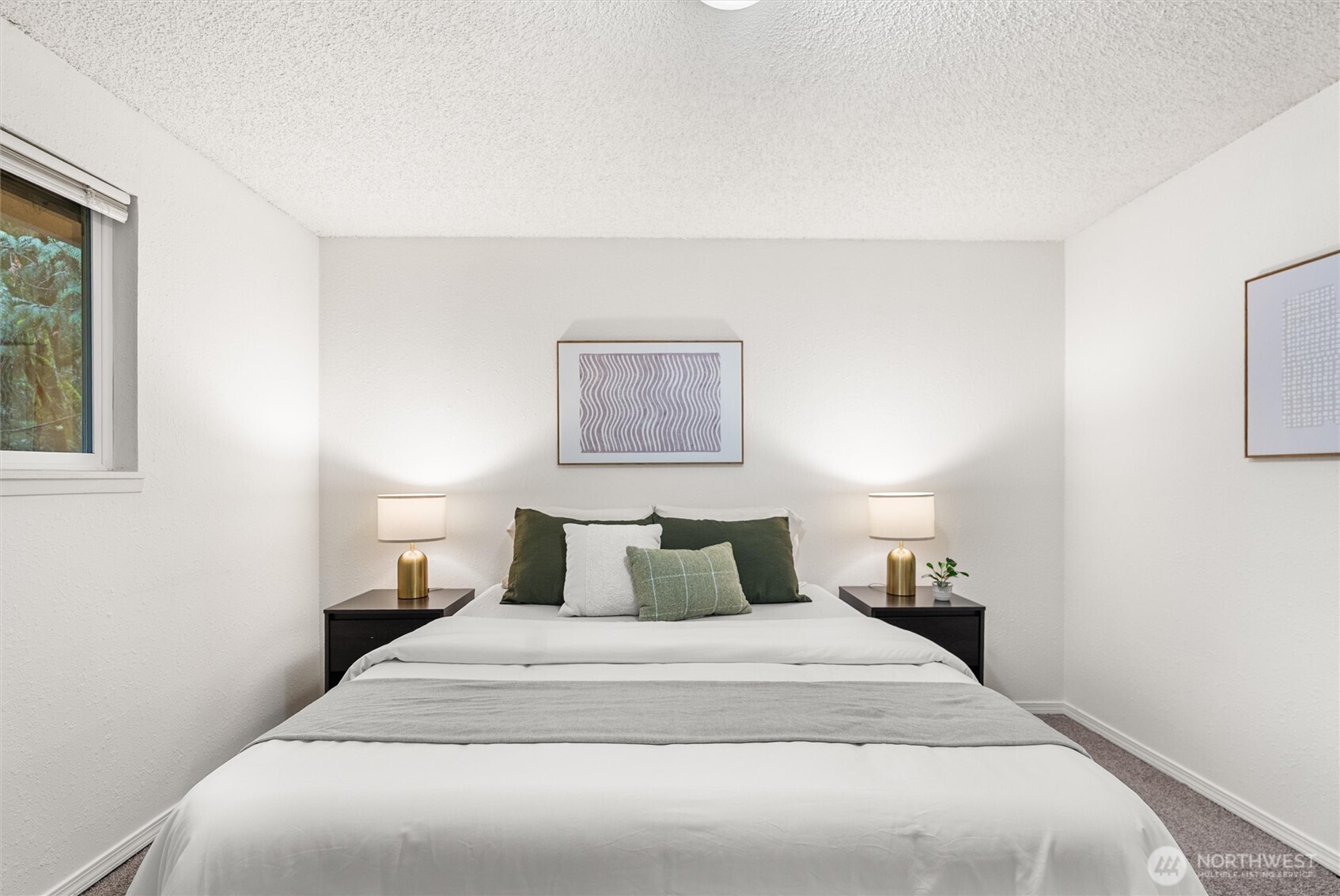 4785 Northwest Anderson Hill Road Silverdale, WA 98383 - Photo 23 of 38 a bedroom with a bed and a night stand