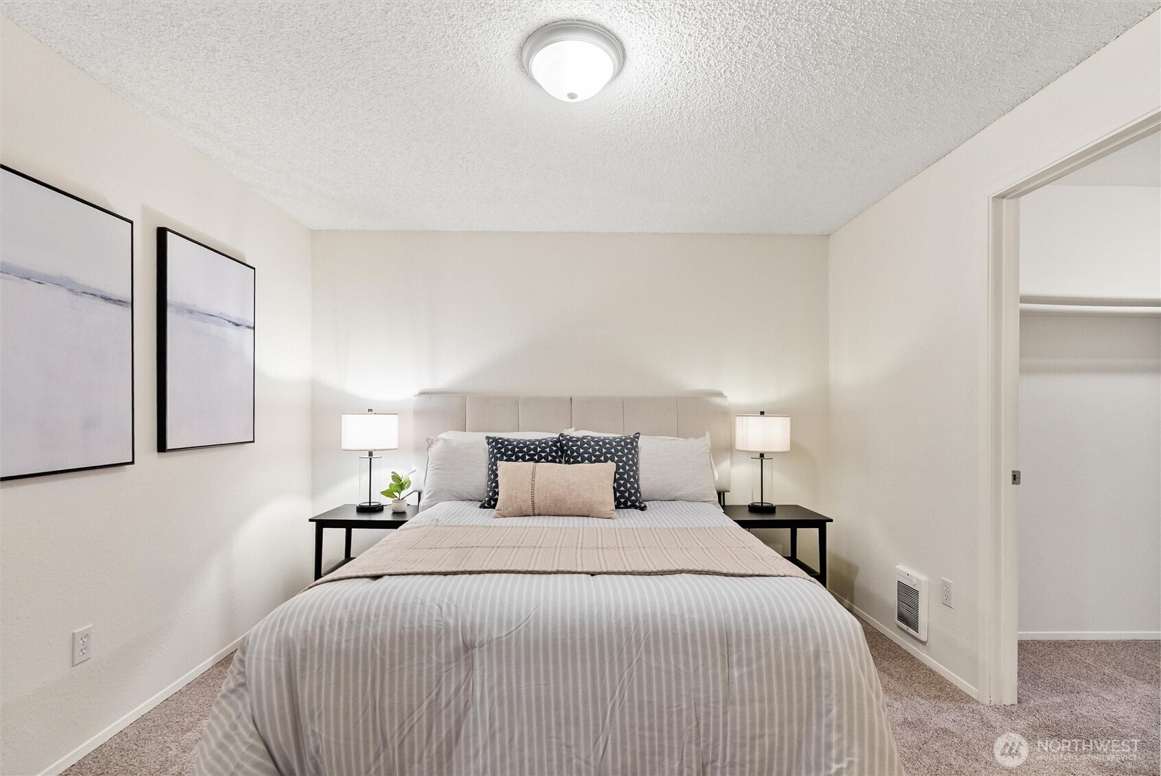 4785 Northwest Anderson Hill Road Silverdale, WA 98383 - Photo 25 of 38 a bedroom with a bed and a night stand
